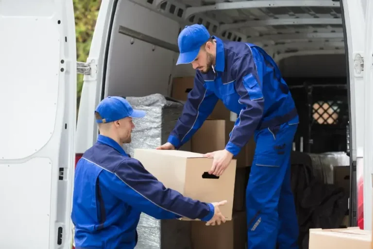 Master Movers London workers unloading a van during a house move in West London, ensuring safe and efficient removals.