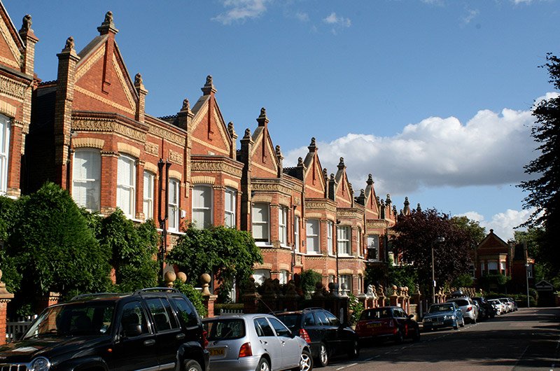 Barnes riverside in South West London with traditional houses, leafy streets, and views along the River Thames near Barnes Bridge