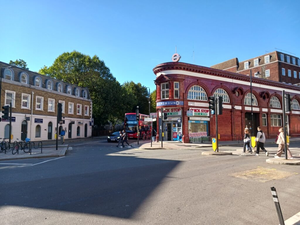 Chalk Farm Road in North London with flats, shops and busy urban surroundings near Camden